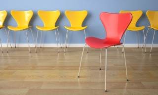 row of chairs on blue wall